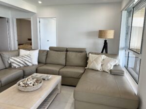 Cozy indoor sitting place, with comfortable sofas with the window view overlooking the lake