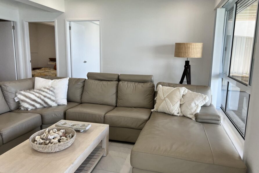 Cozy indoor sitting place, with comfortable sofas with the window view overlooking the lake